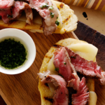 Mini Open Faced Steak Sandwiches on Garlic Bread with Aged Provolone and Parsley Oil