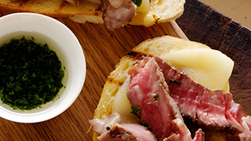 Mini Open Faced Steak Sandwiches on Garlic Bread with Aged Provolone and Parsley Oil