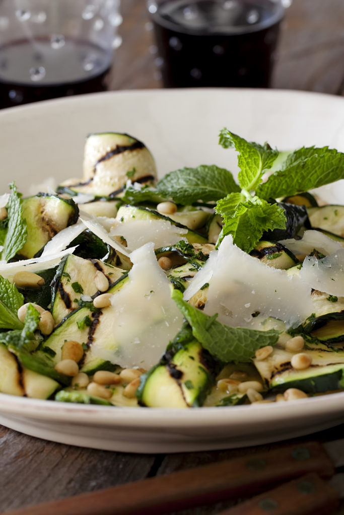 Grilled Zucchini Salad with Lemon-Herb Vinaigrette and Shaved Romano and Toasted Pine Nuts