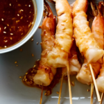 Grilled Shrimp Skewers with Soy Sauce, Fresh Ginger and Toasted Sesame Seeds