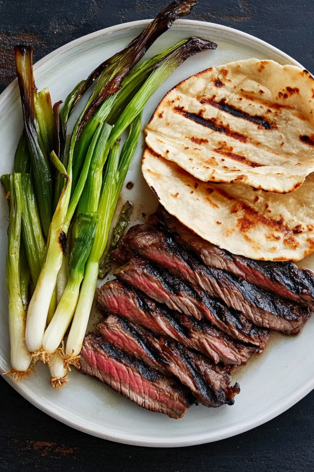 Bobby Flay Korean-Style Marinated Skirt Steak with Grilled Scallions and Warm Tortillas